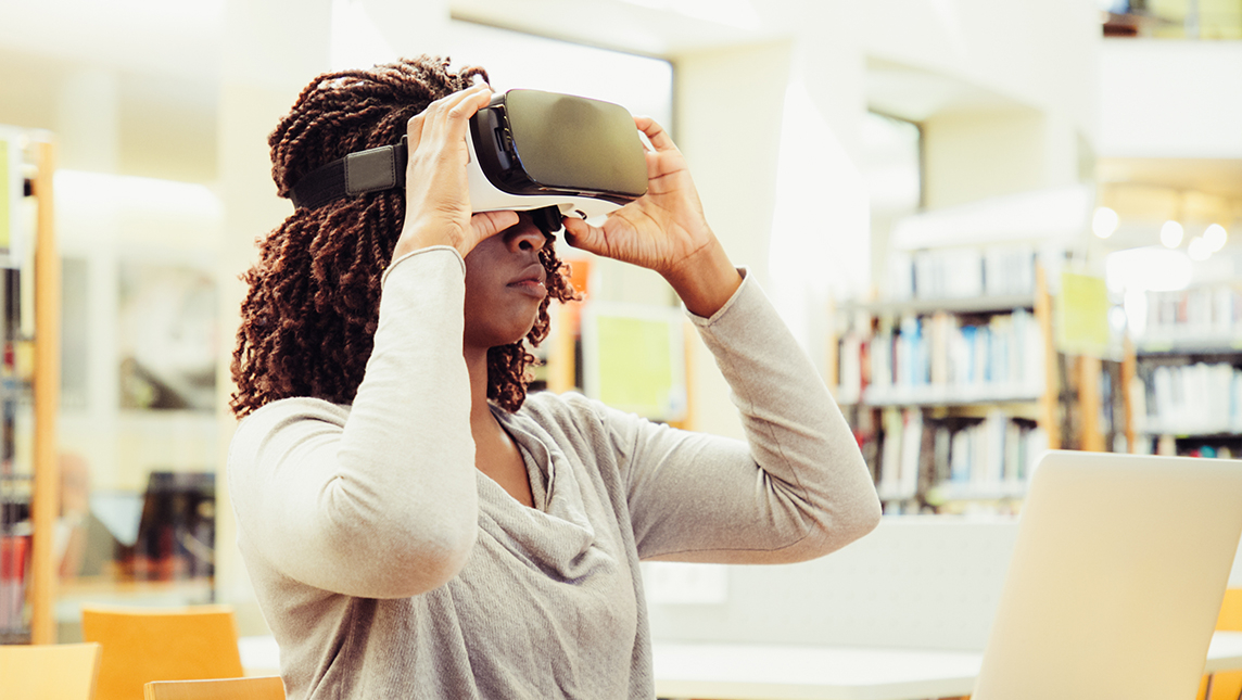 Female student using a virtual reality headset.